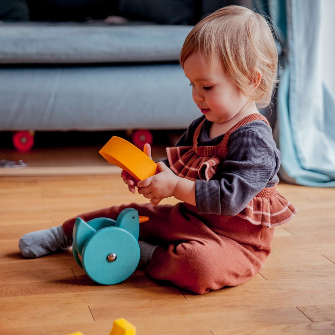 Wooden hen on wheels (roly-poly toy)