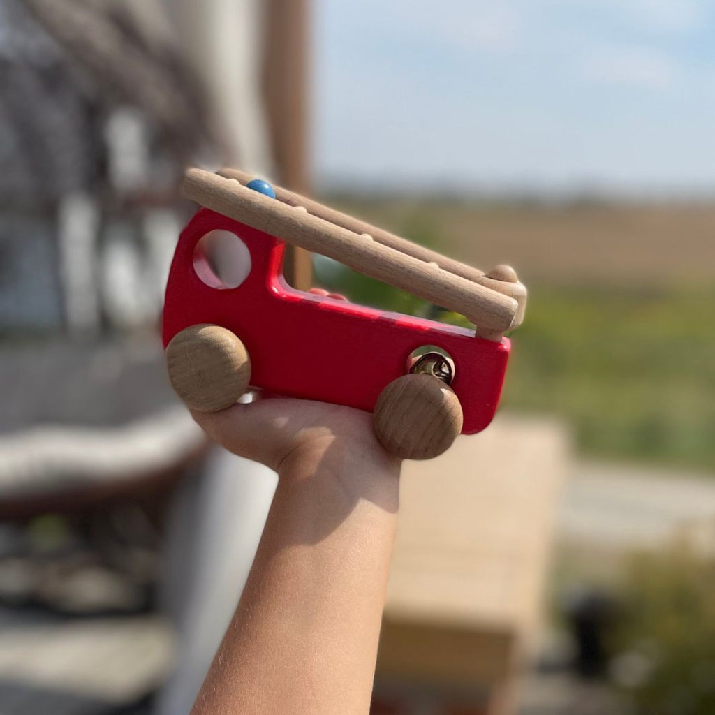 Fire truck with a bell and a movable ladder